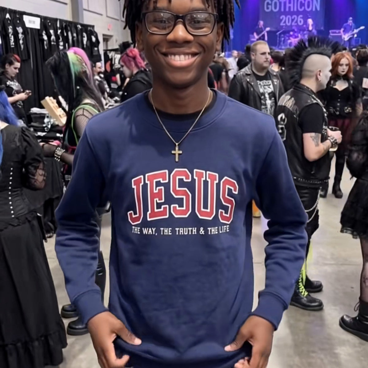 Actual navy JESUS varsity crewneck sweatshirt being worn